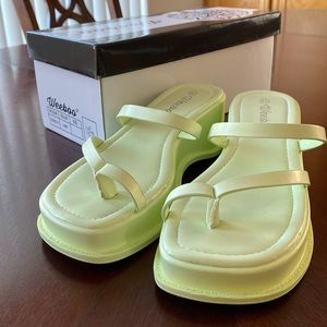 Trendy, lime-green, platform sandal.